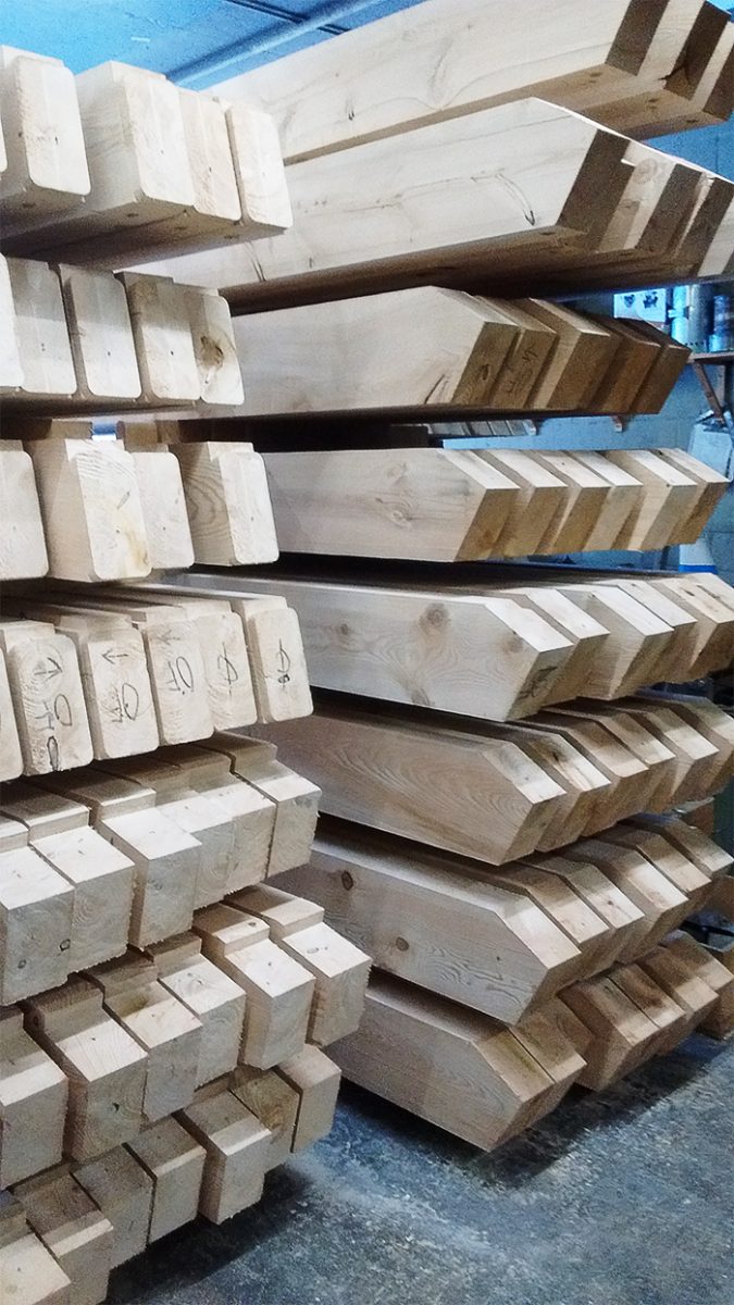 All the beams neatly stacked and numbered, ready to be assembled like a giant Tinker Toy!