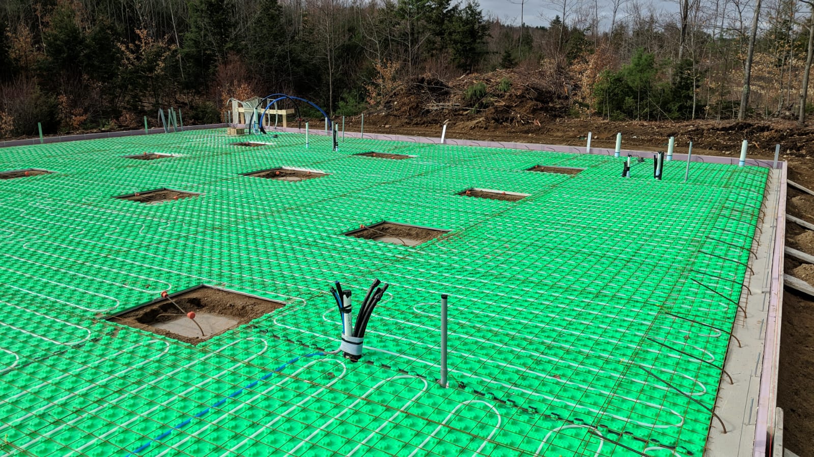 Under the slab is 2\" of foam \"Crete Heat\" which provides channels for the pex tubing