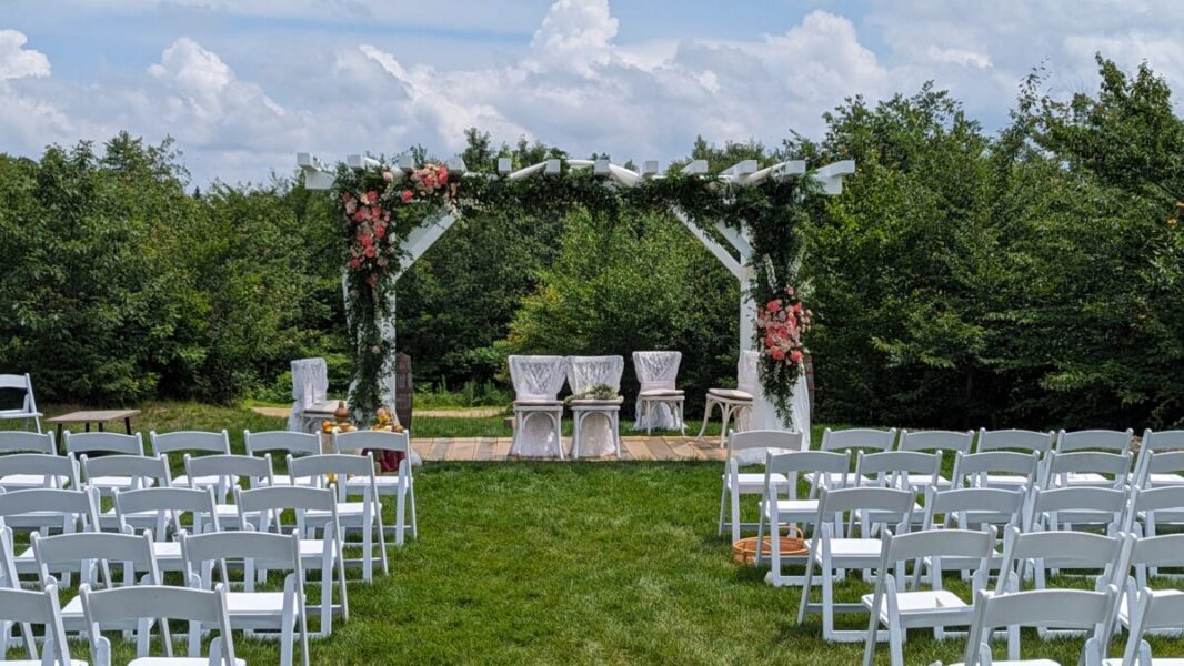 Outdoor ceremony lawn - white chairs and decorations included!